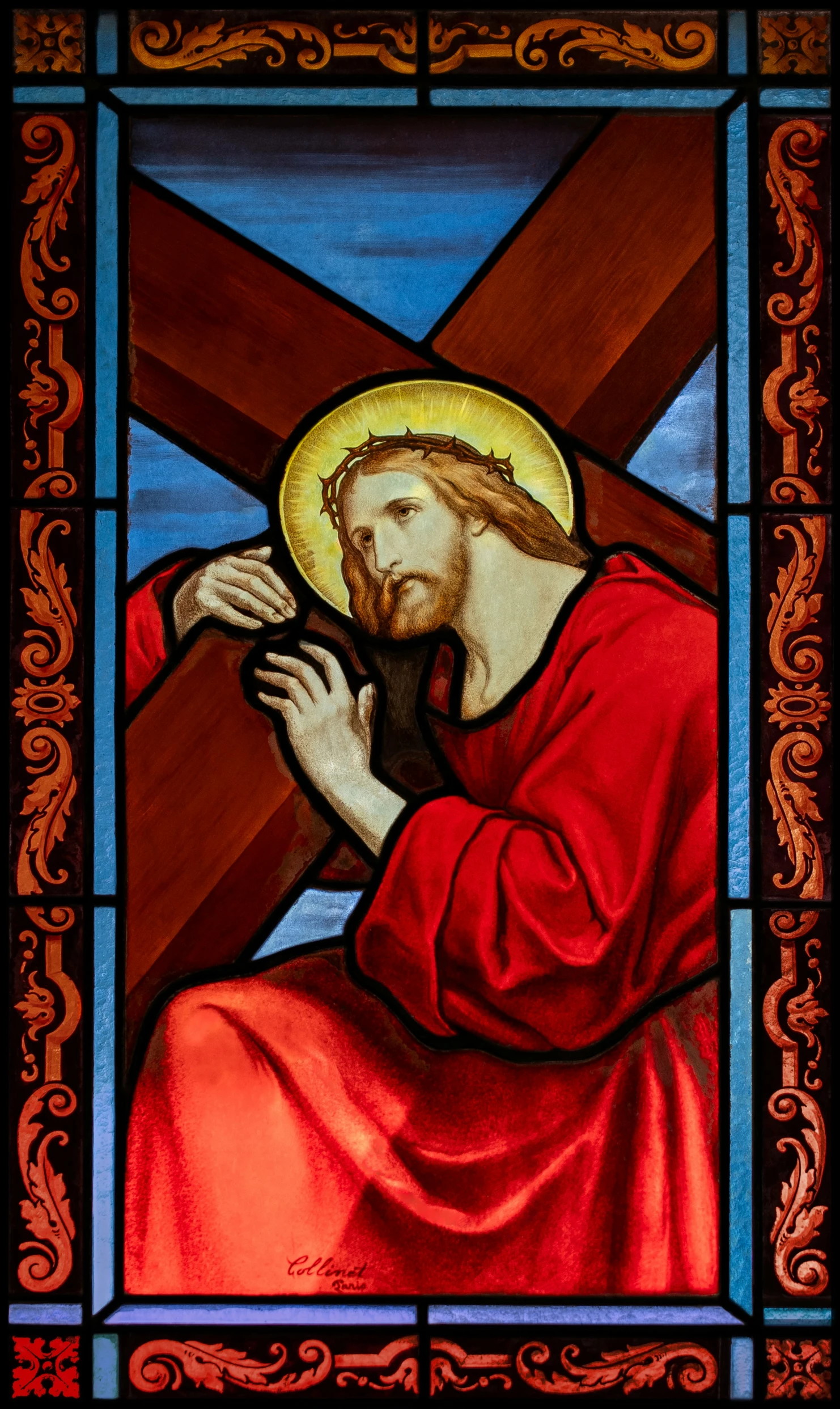 stained glass with a picture of jesus on it