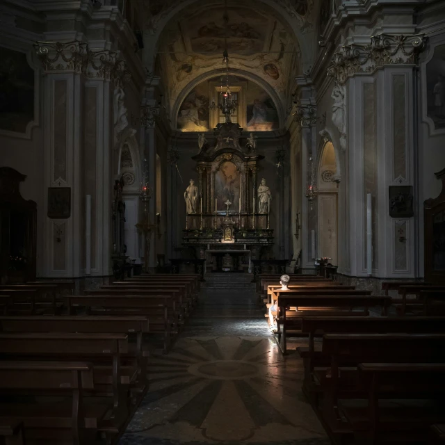 a long and empty church is seen during the day