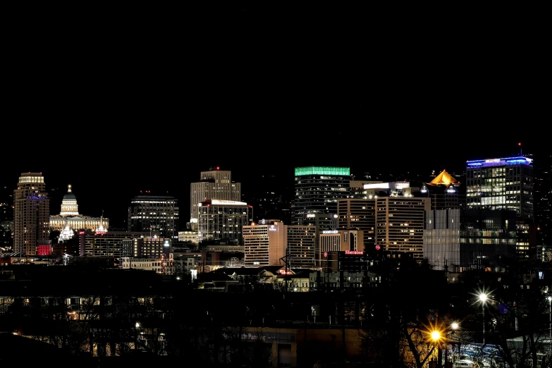 a city is shown in the dark at night