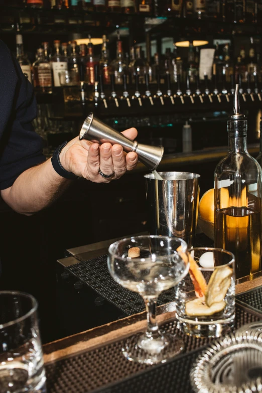 there is a person at the bar preparing to serve some drinks