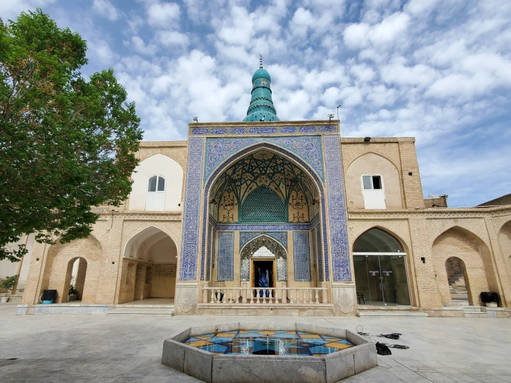 a building with a fountain in front