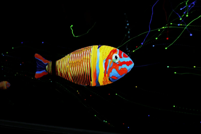a large decorative fish with many small lights around