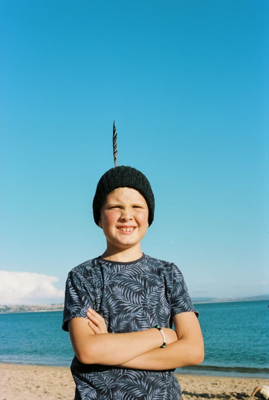 a  is standing in front of the ocean