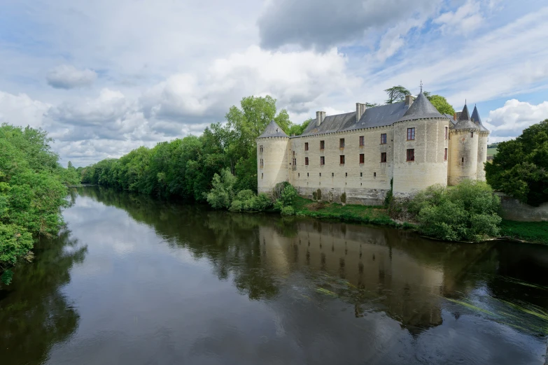 the medieval castle and its moat on a river