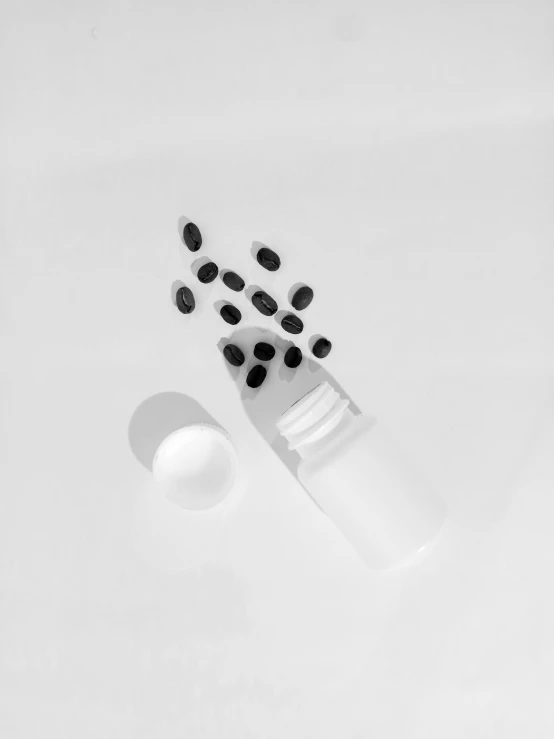 a toothbrush with a lot of black dots next to it