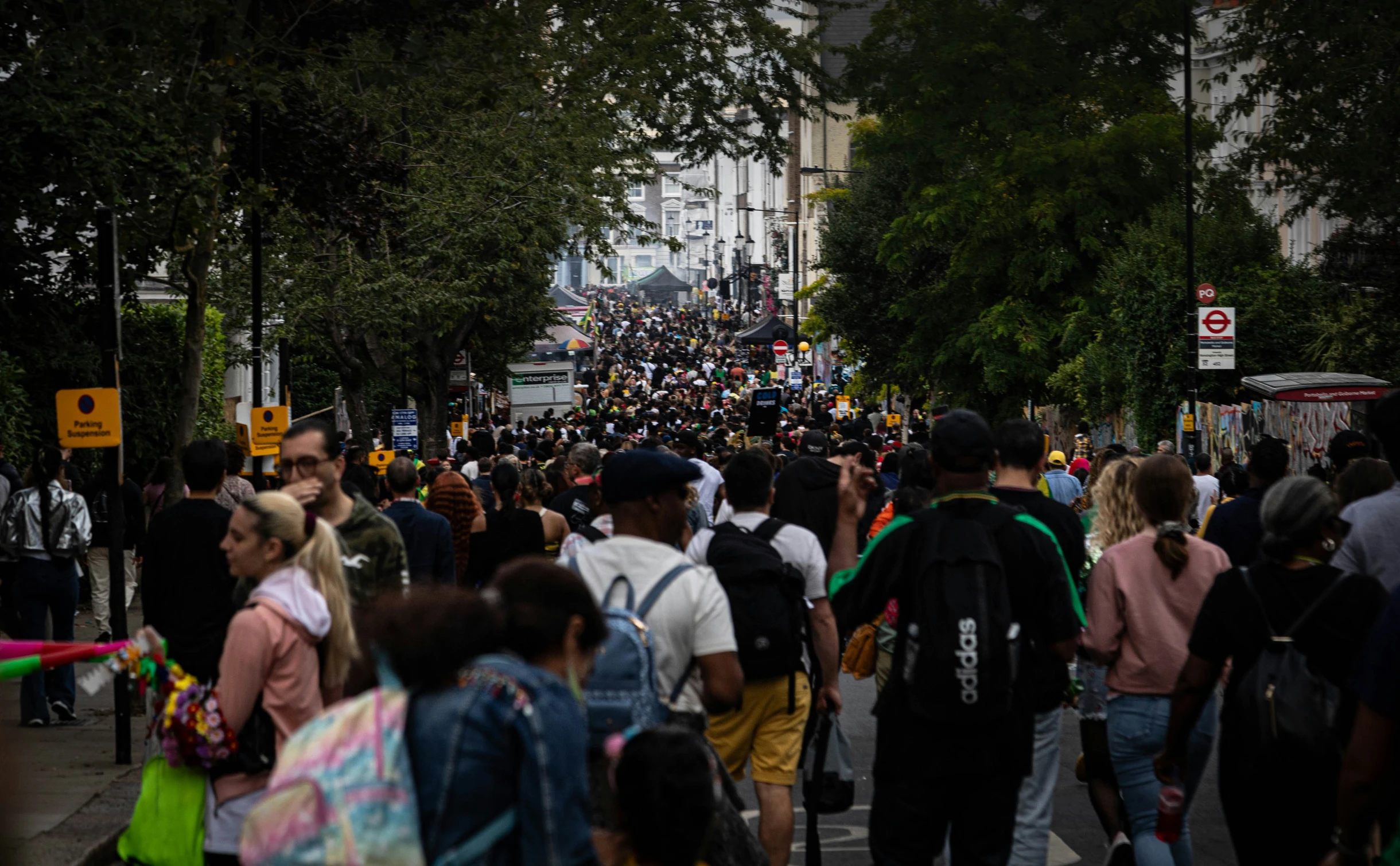 many people are walking on a busy street