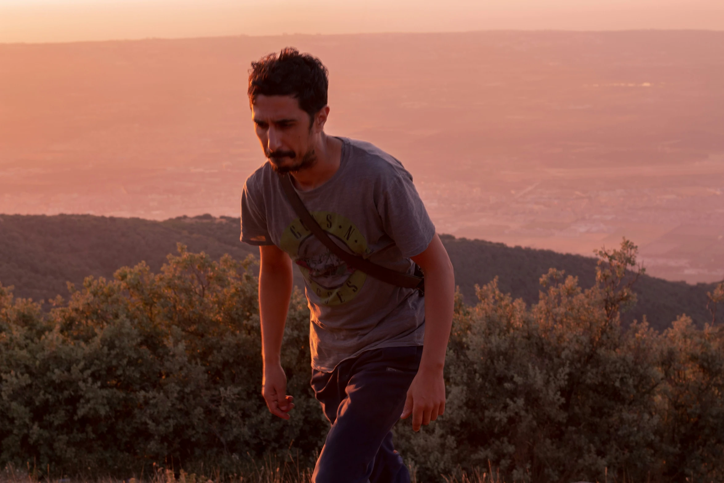 a man riding a skateboard down a hill