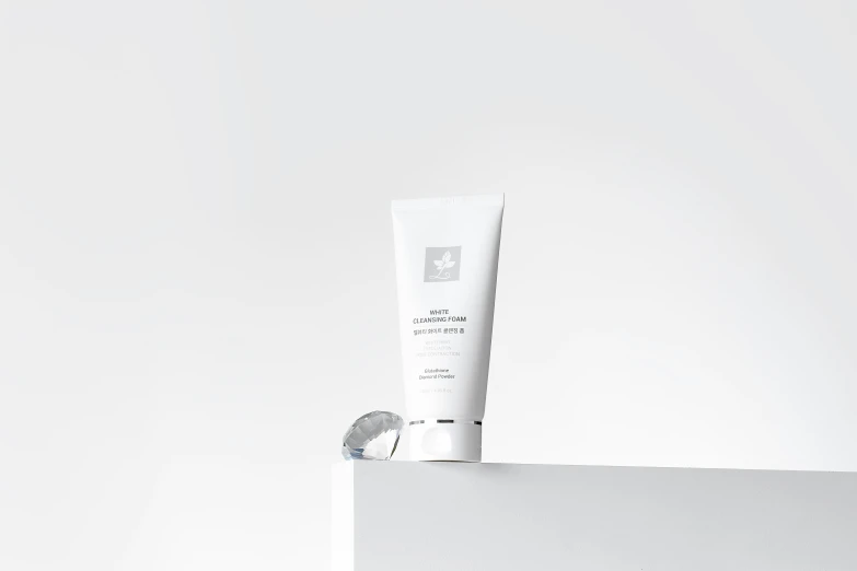 an open tube of the face cream sits on a white box