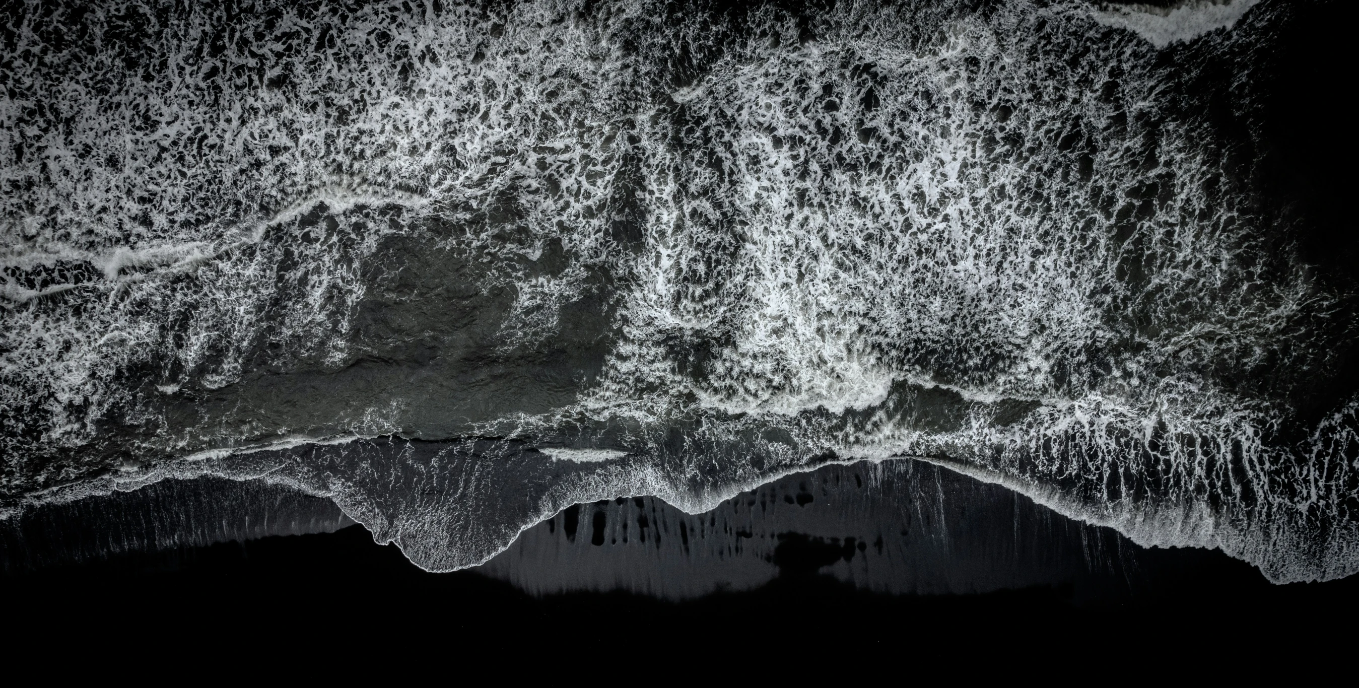 some black and white foam in a pool