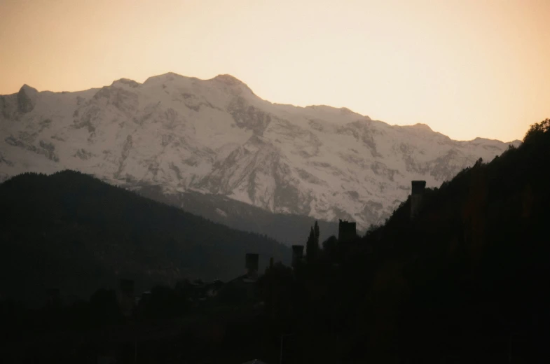 silhouettes of mountains against a hazy sky