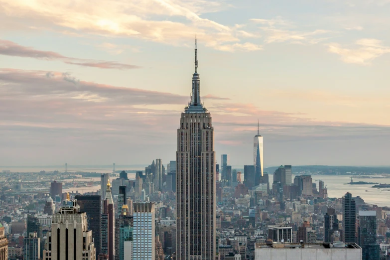 the top of the empire building towering over a city