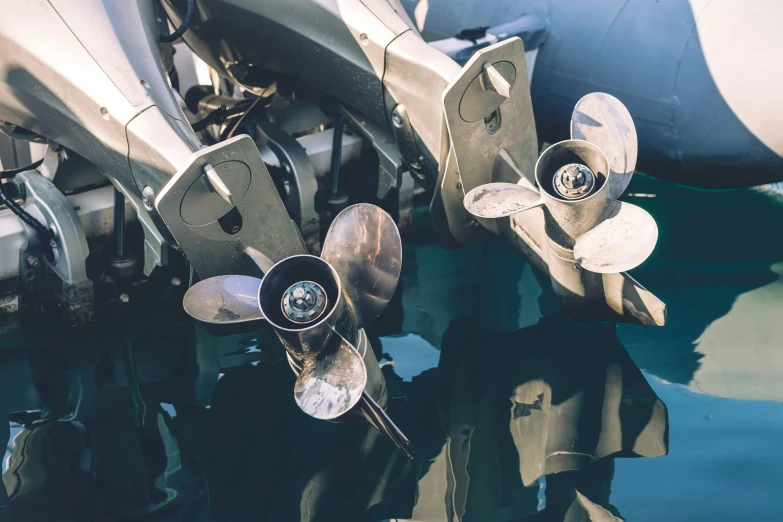 several propeller propellers sitting on top of a body of water