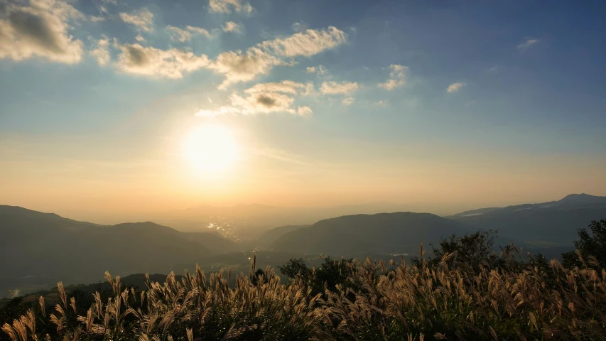 a sunrise that has seen the mountains in the background