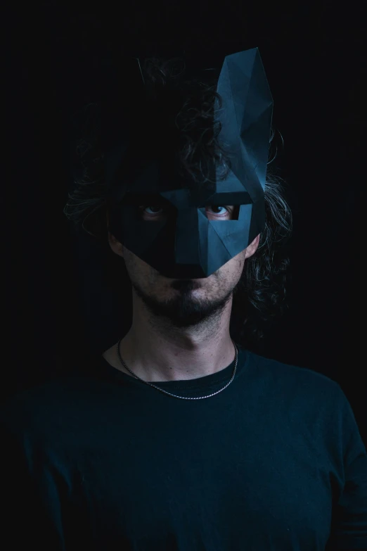 a man wearing a paper mask looks off to the side