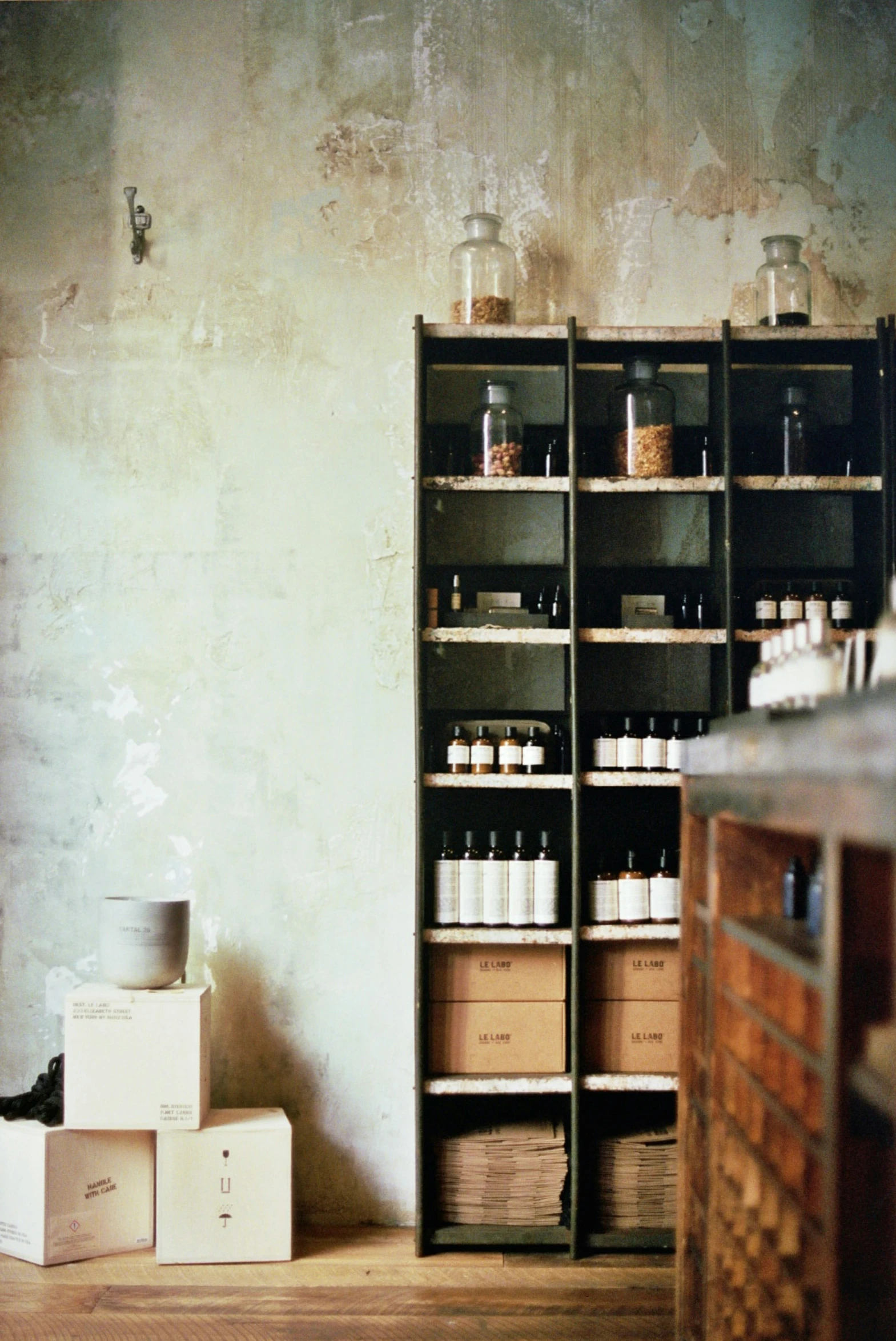 boxes of medicine are stacked in front of shelves