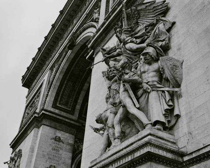 the angelic and the cupid statues are located on the side of a building