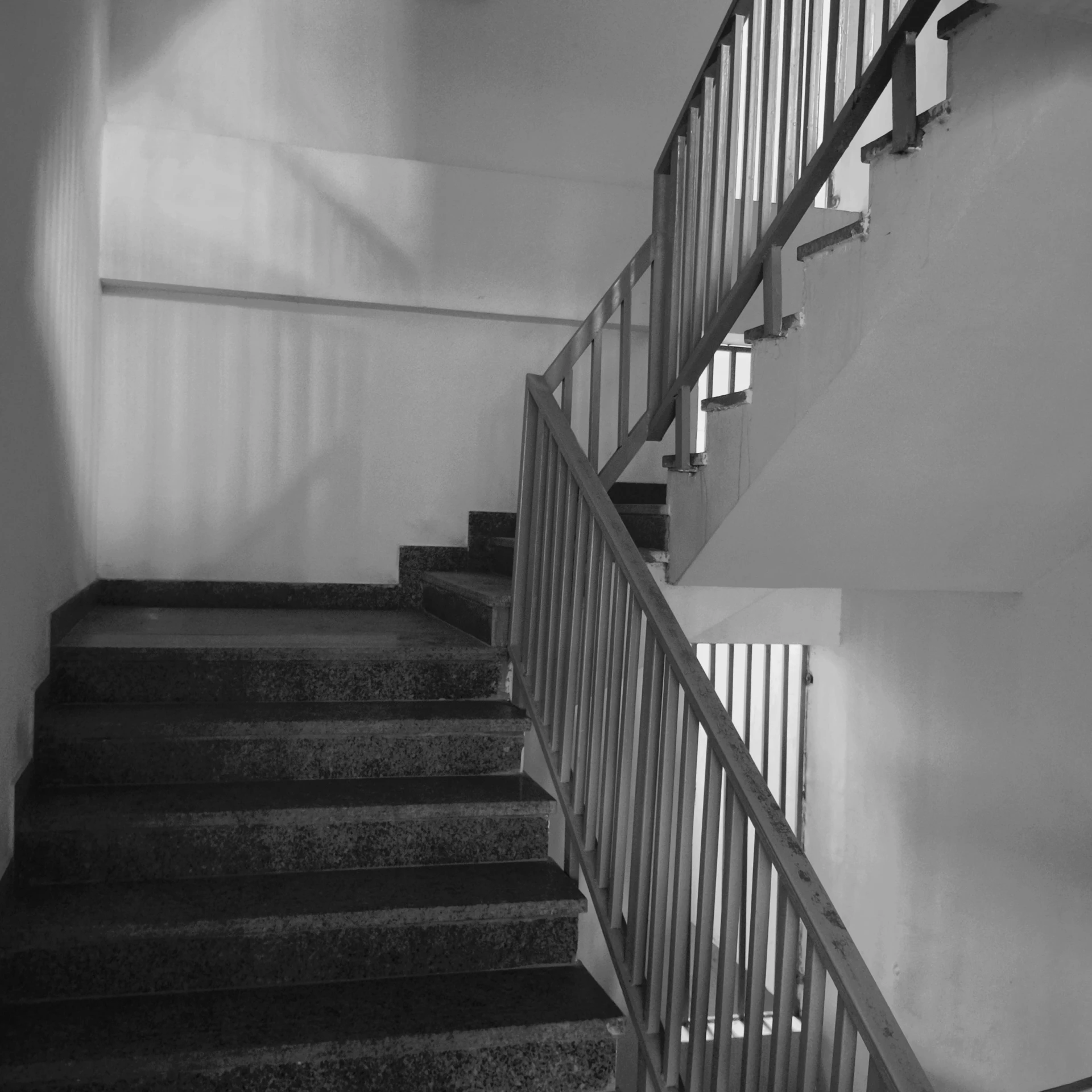 a stairway is shown with railing and handrails