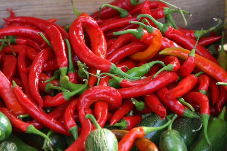 a pile of peppers next to each other