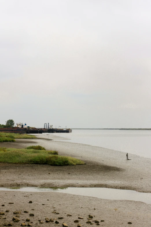 people are riding boats along the beach