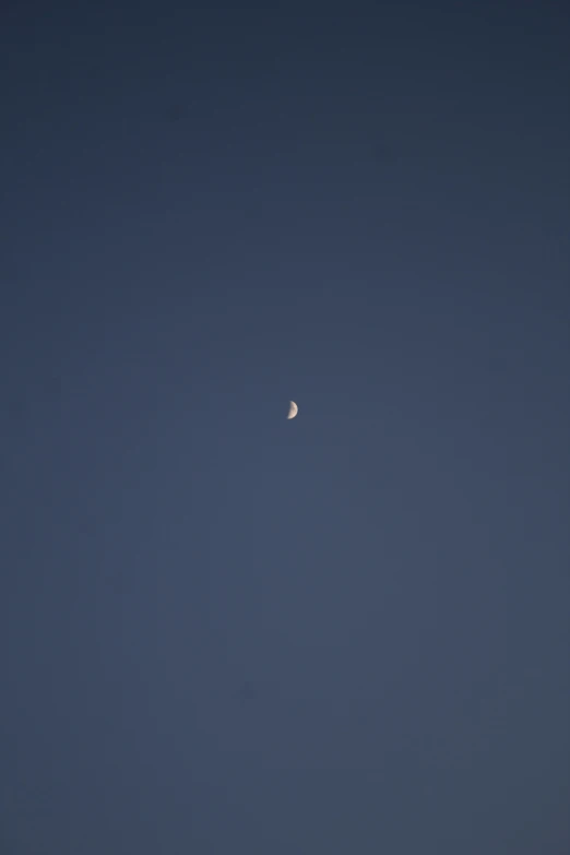 an image of the moon against the horizon