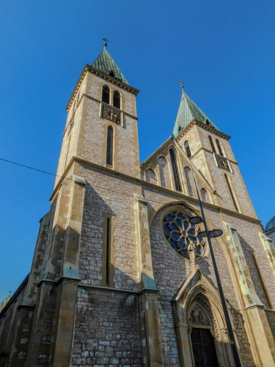 an old building has two towers with clock