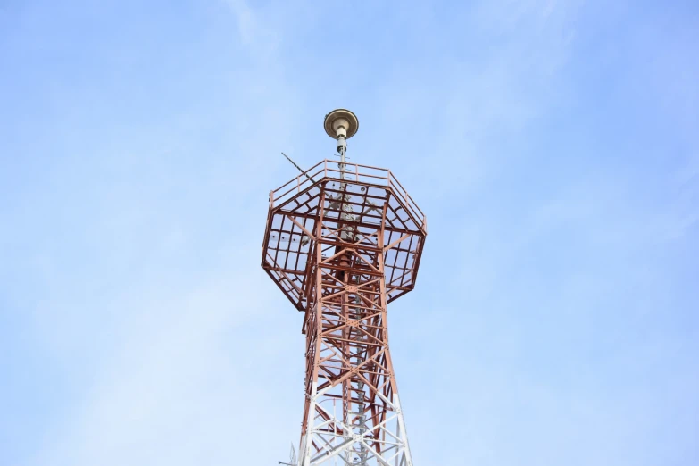 there is a metal tower under a blue sky