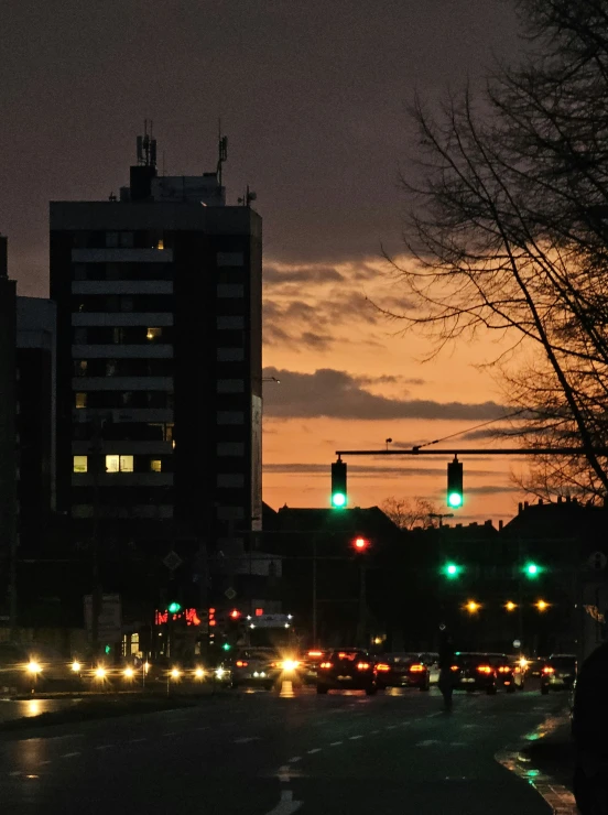 a view of traffic in the city at dusk