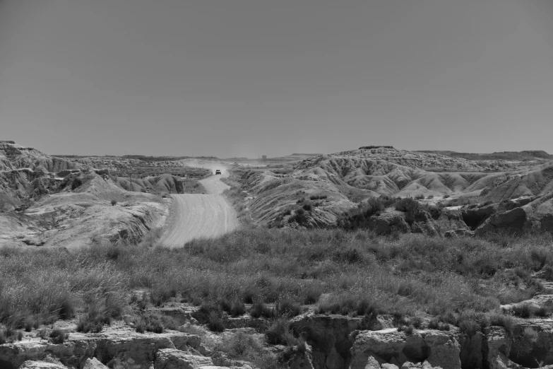 black and white po of a dirt road in the country