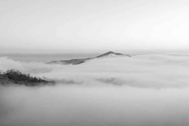 a view of the sea with fog on it