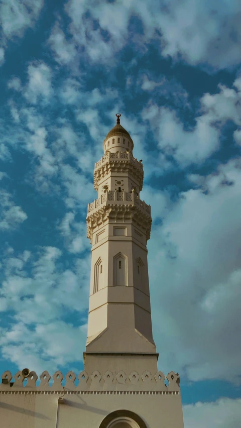 the clock is located on top of this large tower