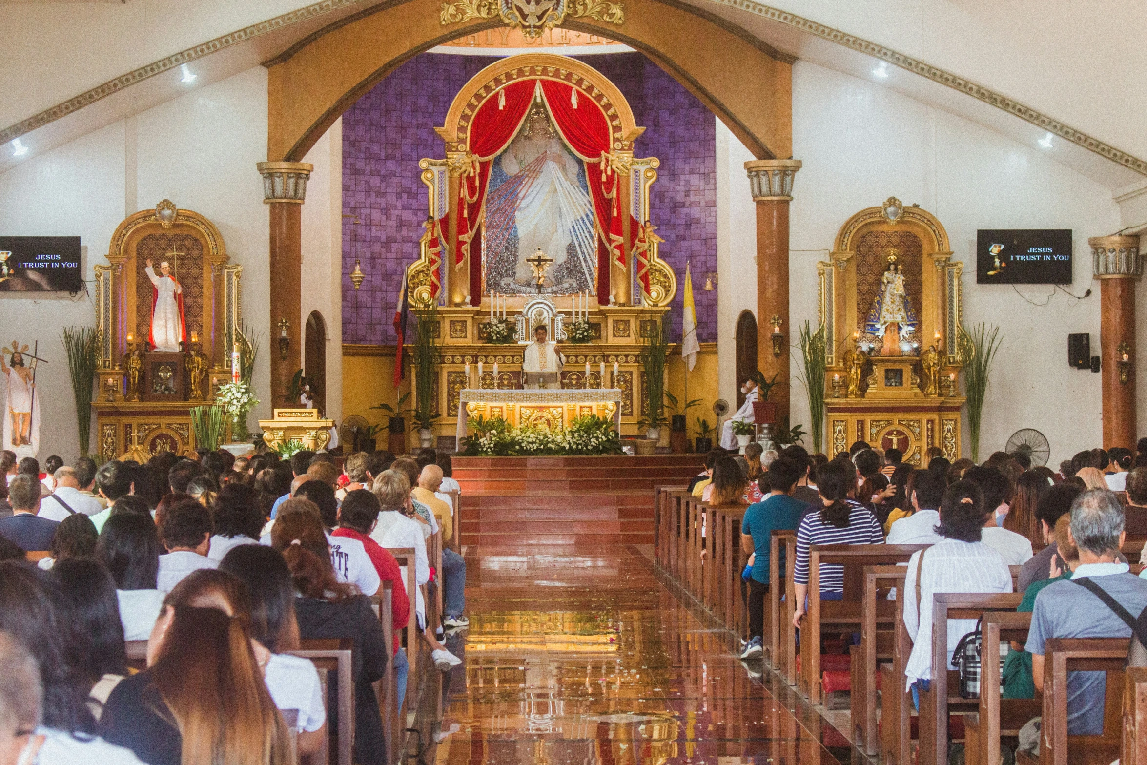 a church filled with people sitting down