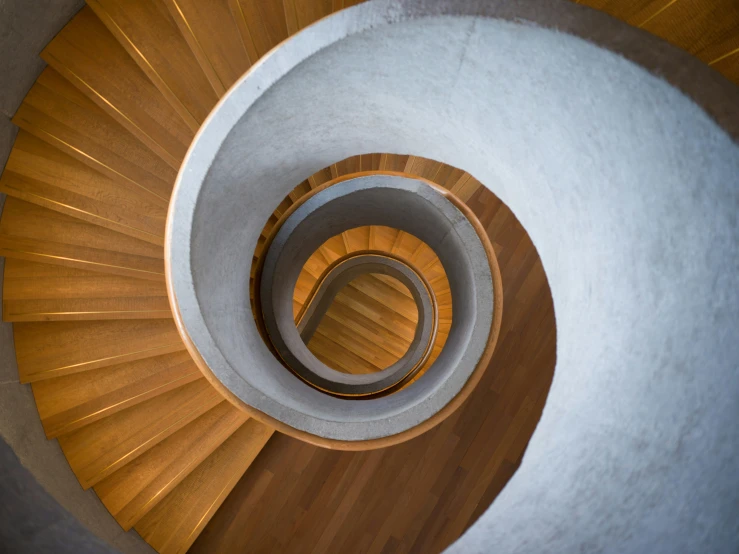 a very high and steep view of a wooden stair