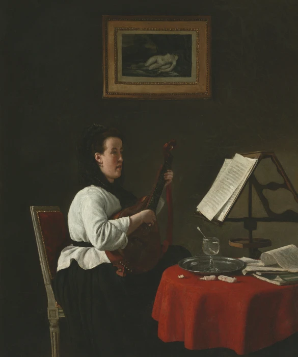 a woman holding an instrument and looking at it