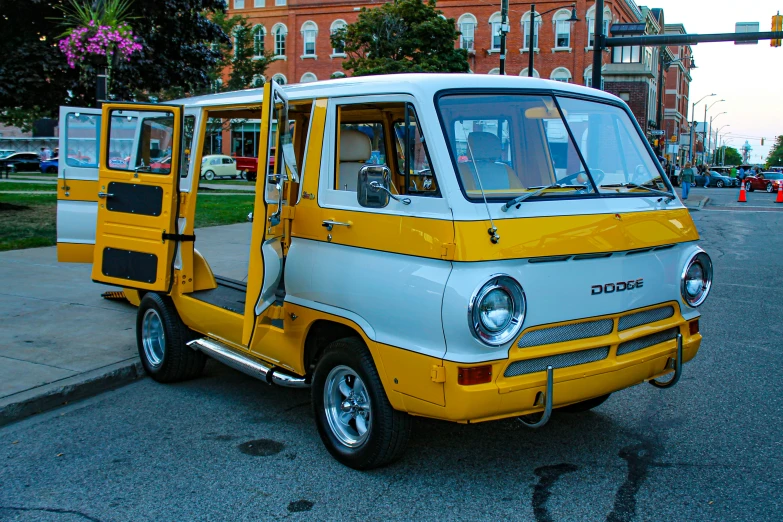 an old fashioned yellow and white two door truck