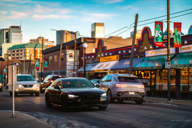 cars in the street on a busy city street