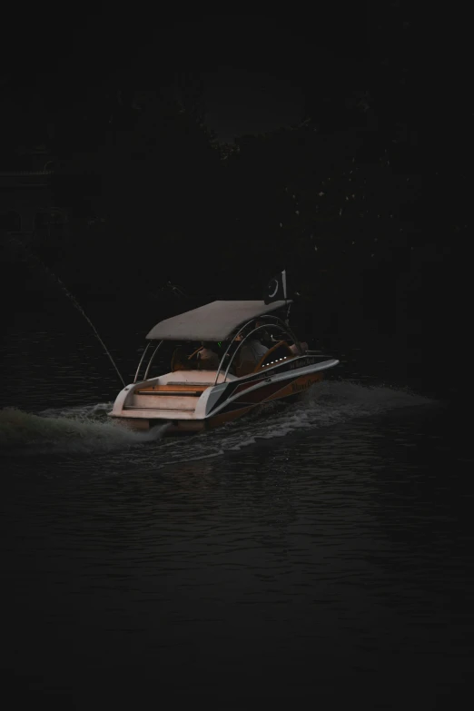 a white and brown boat in the water at night