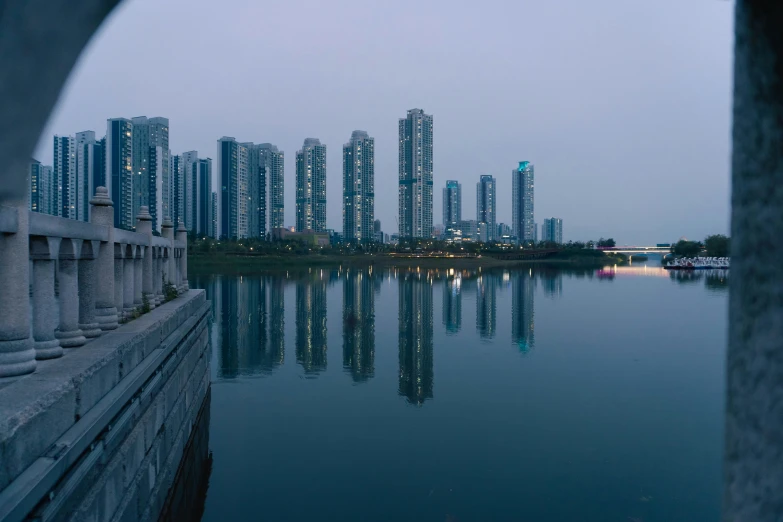 a body of water near a city skyline with buildings on it