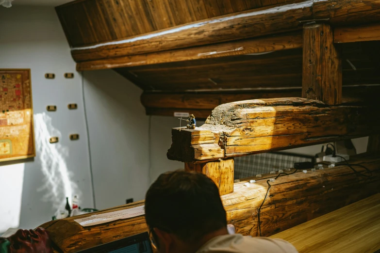 a man standing next to a bed in a room