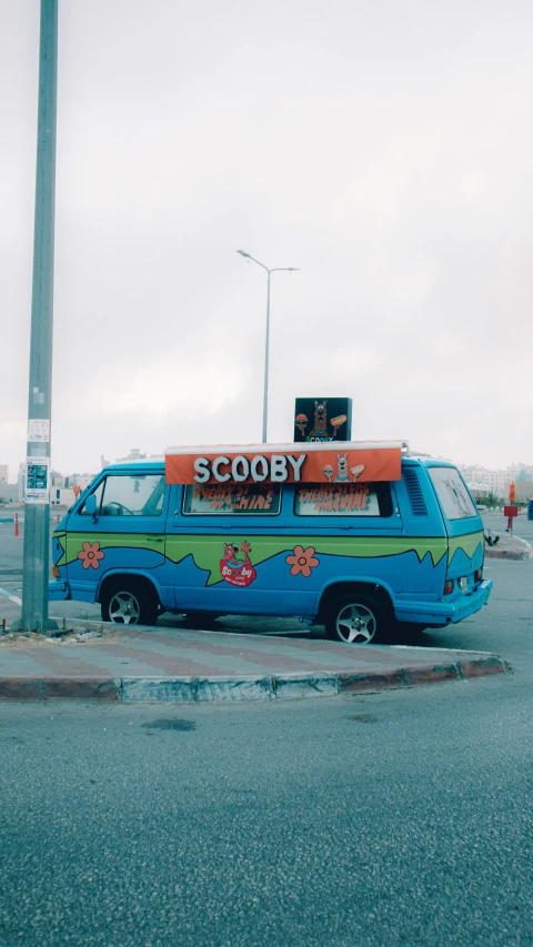 a van parked in front of a street light