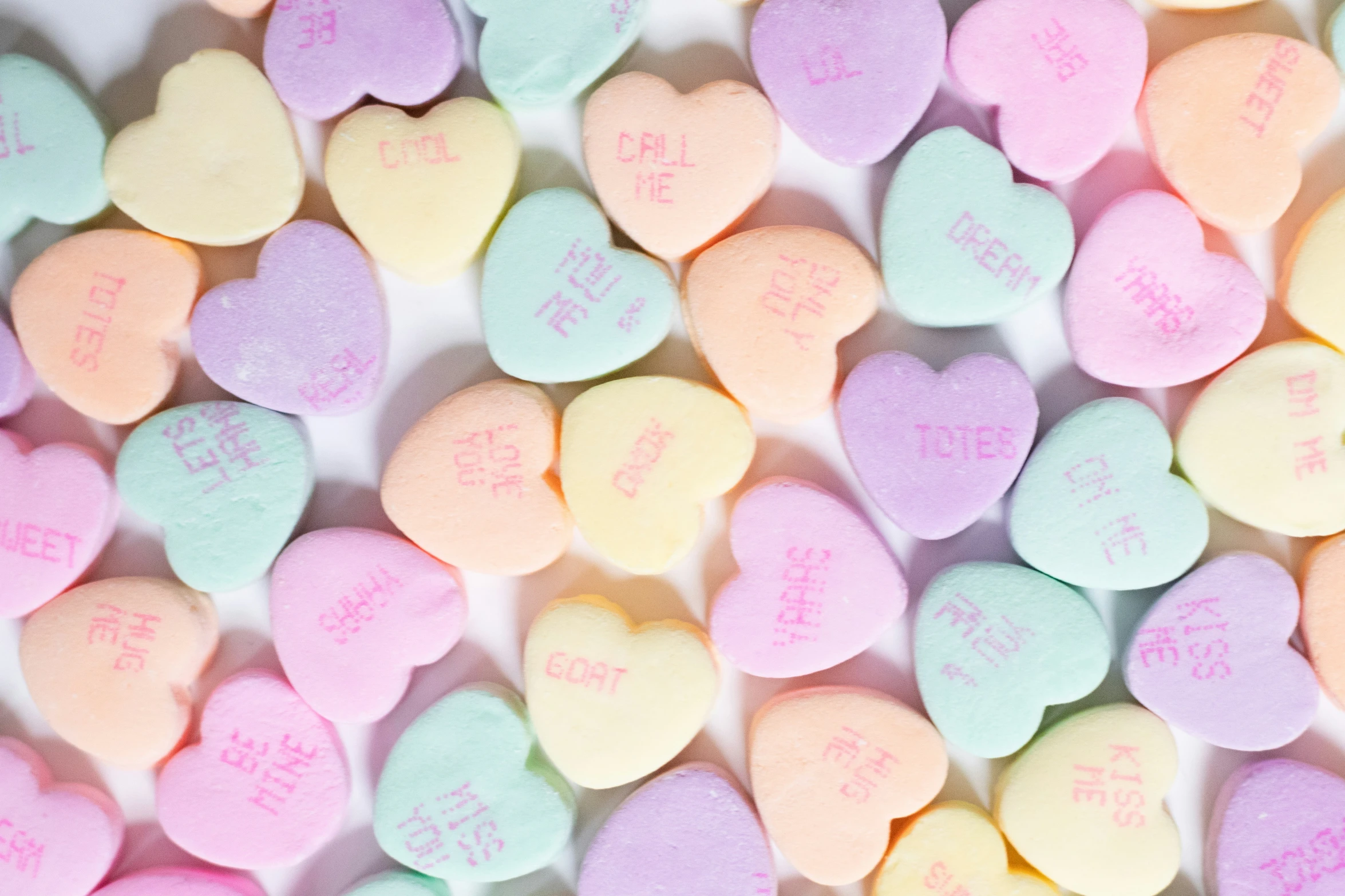 the heart - shaped conversation hearts are the main color of a conversation