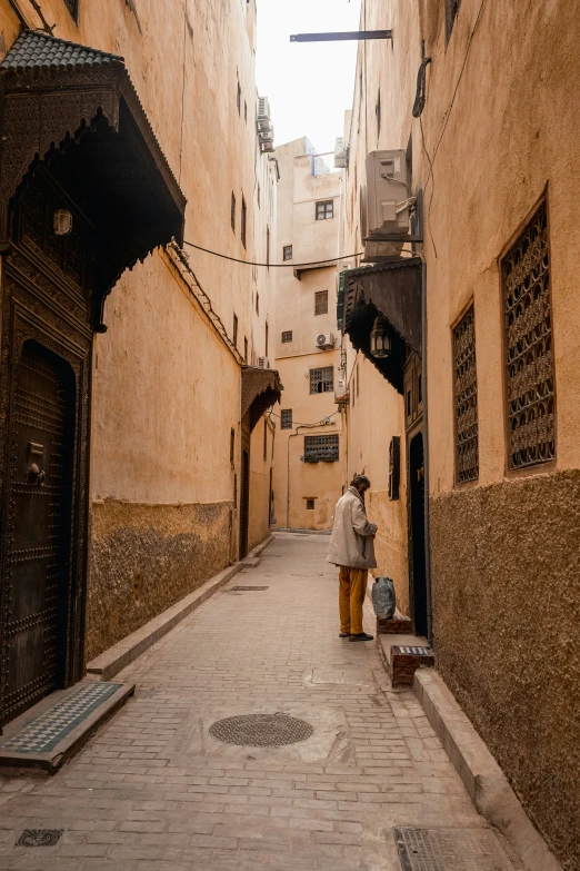 a narrow street in the middle of an old city