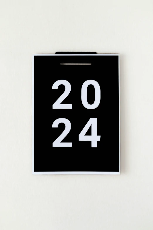 a square white number twenty - four printed onto a black square