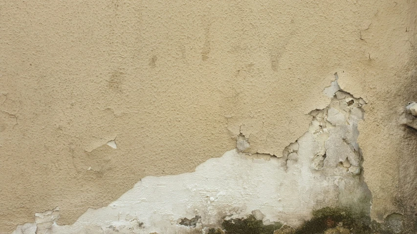 a close up of the wall and ceiling with debris