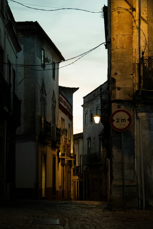 a street in an old city at sunset