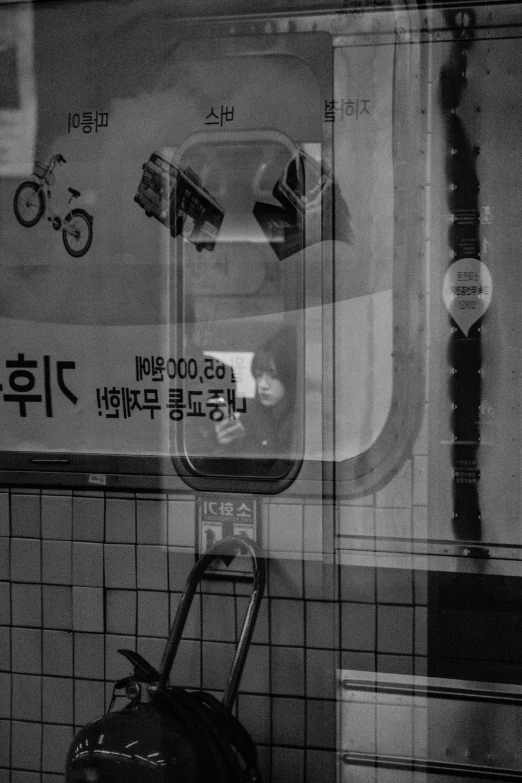 a cart leaning against the wall with advertits in korea