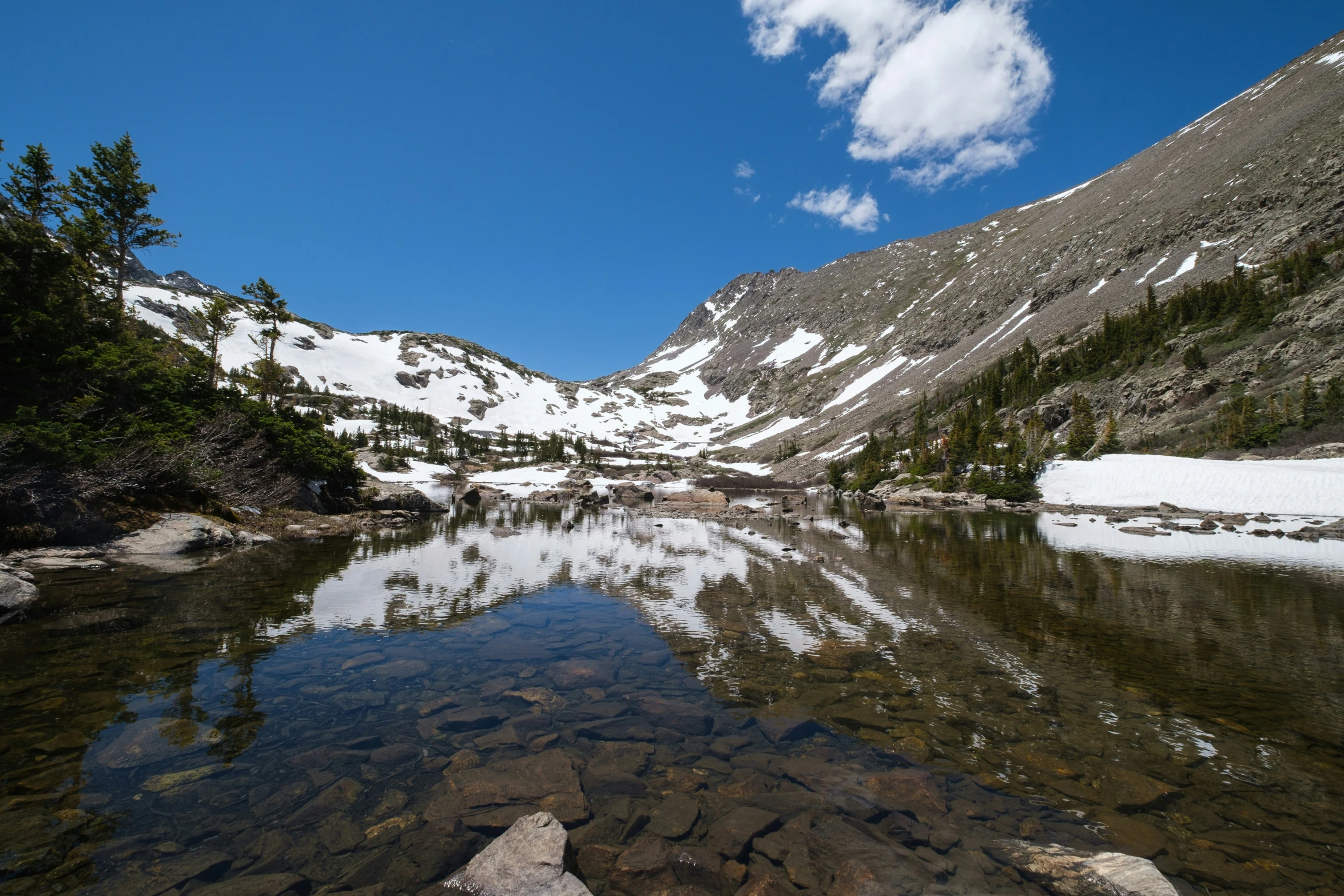 the mountain is covered with snow and ice