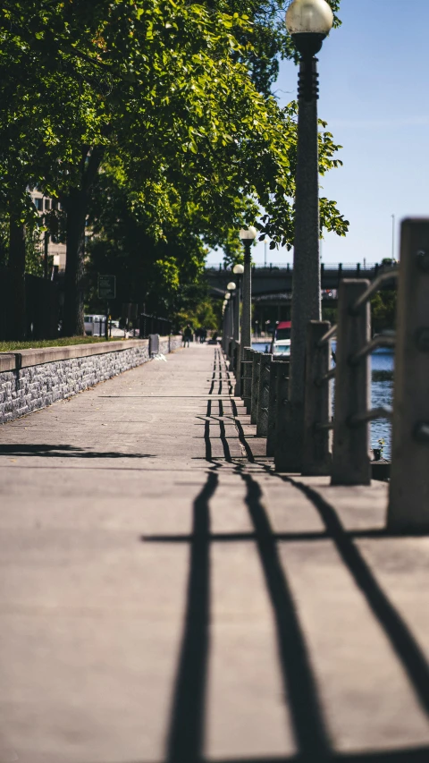 light post and path between buildings by the water