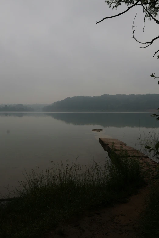 there is a bench sitting by the water