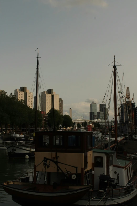 a boat docked on the river in the city