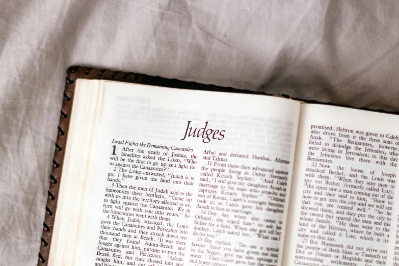 a book laying on top of a white cloth